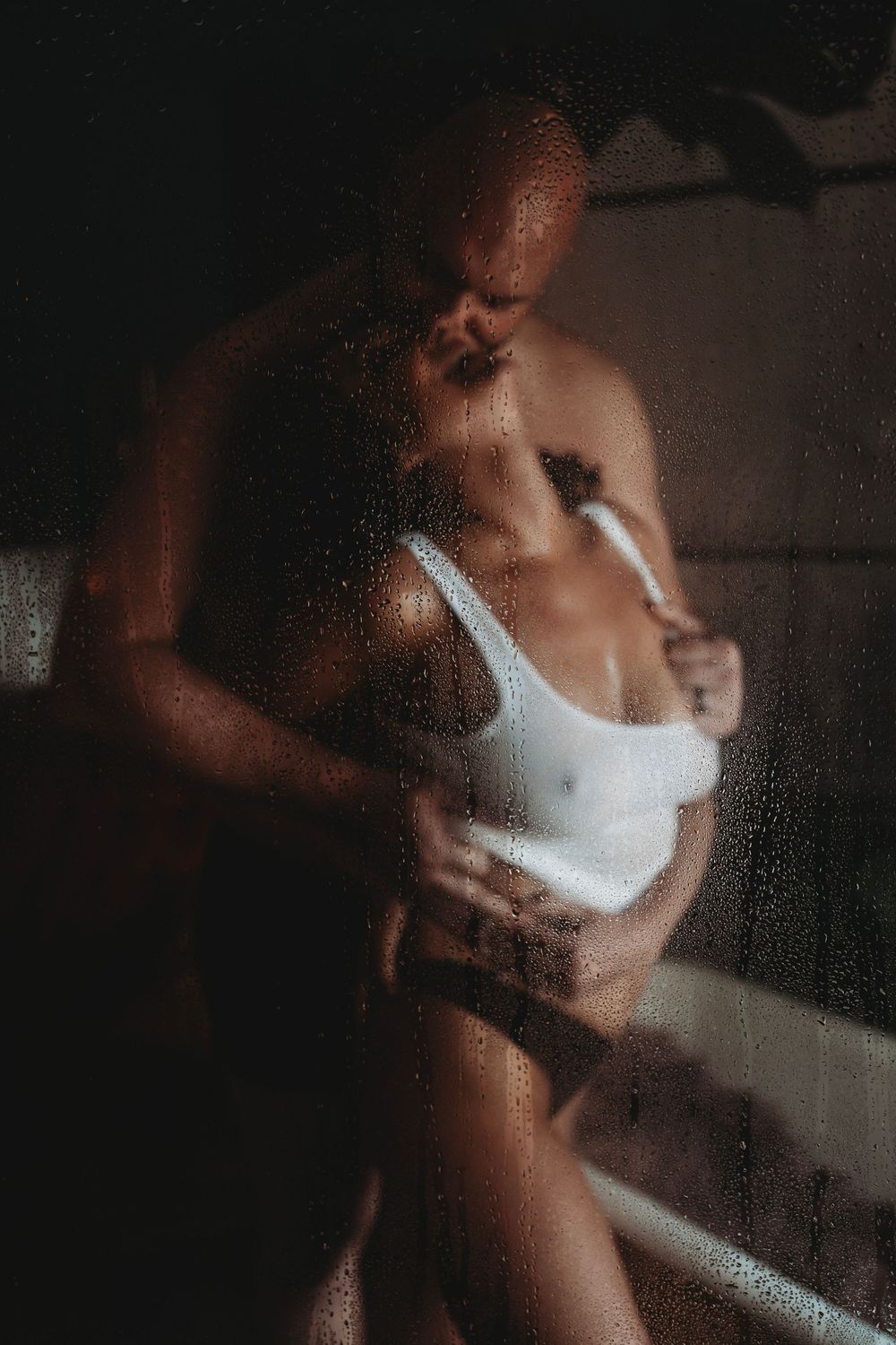 Shower boudoir session featuring couple in steamy shower at tacoma Seattle boudoir studio