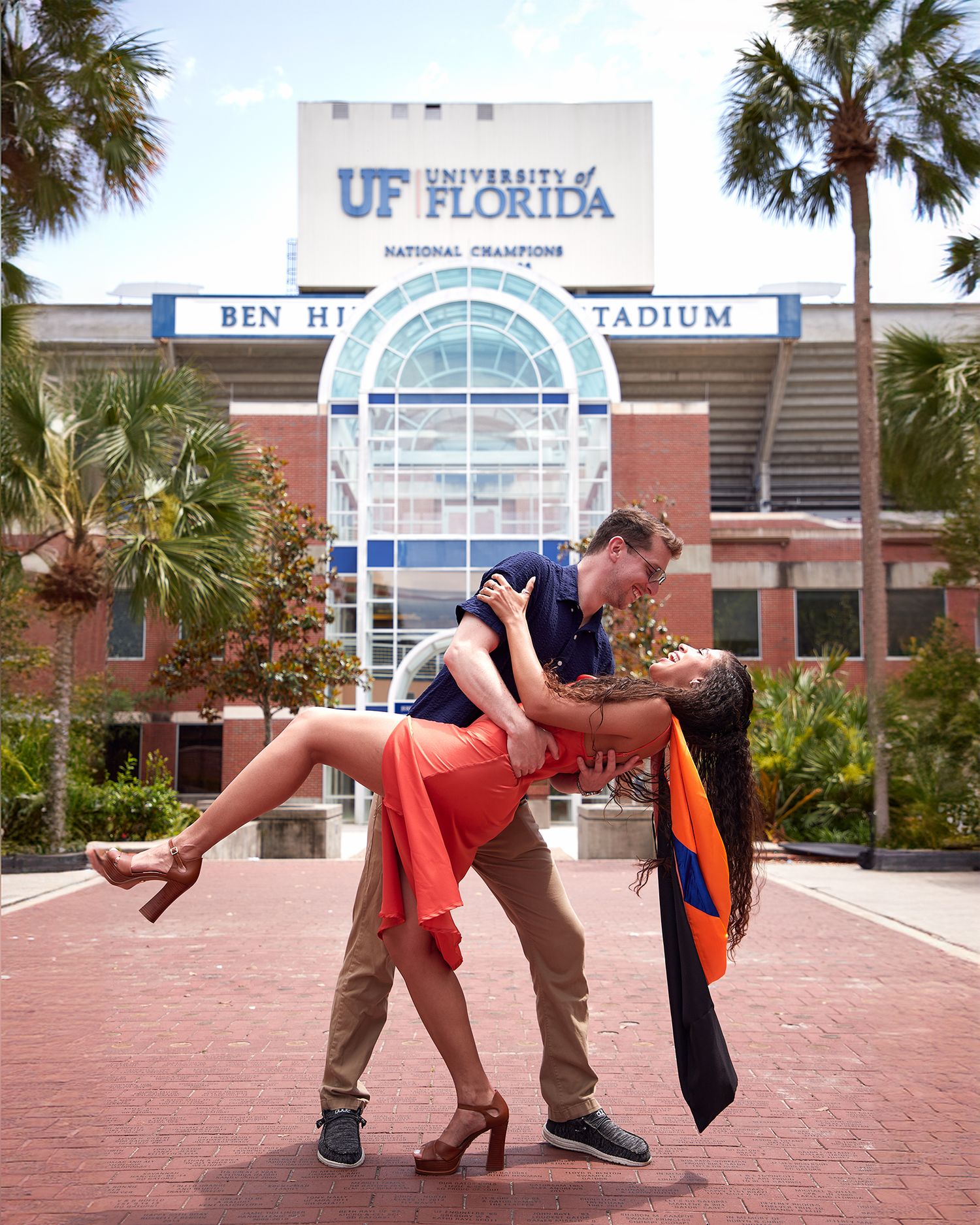 A romantic dip pose in front of UF Florida Ben Hill Griffin Stadium.