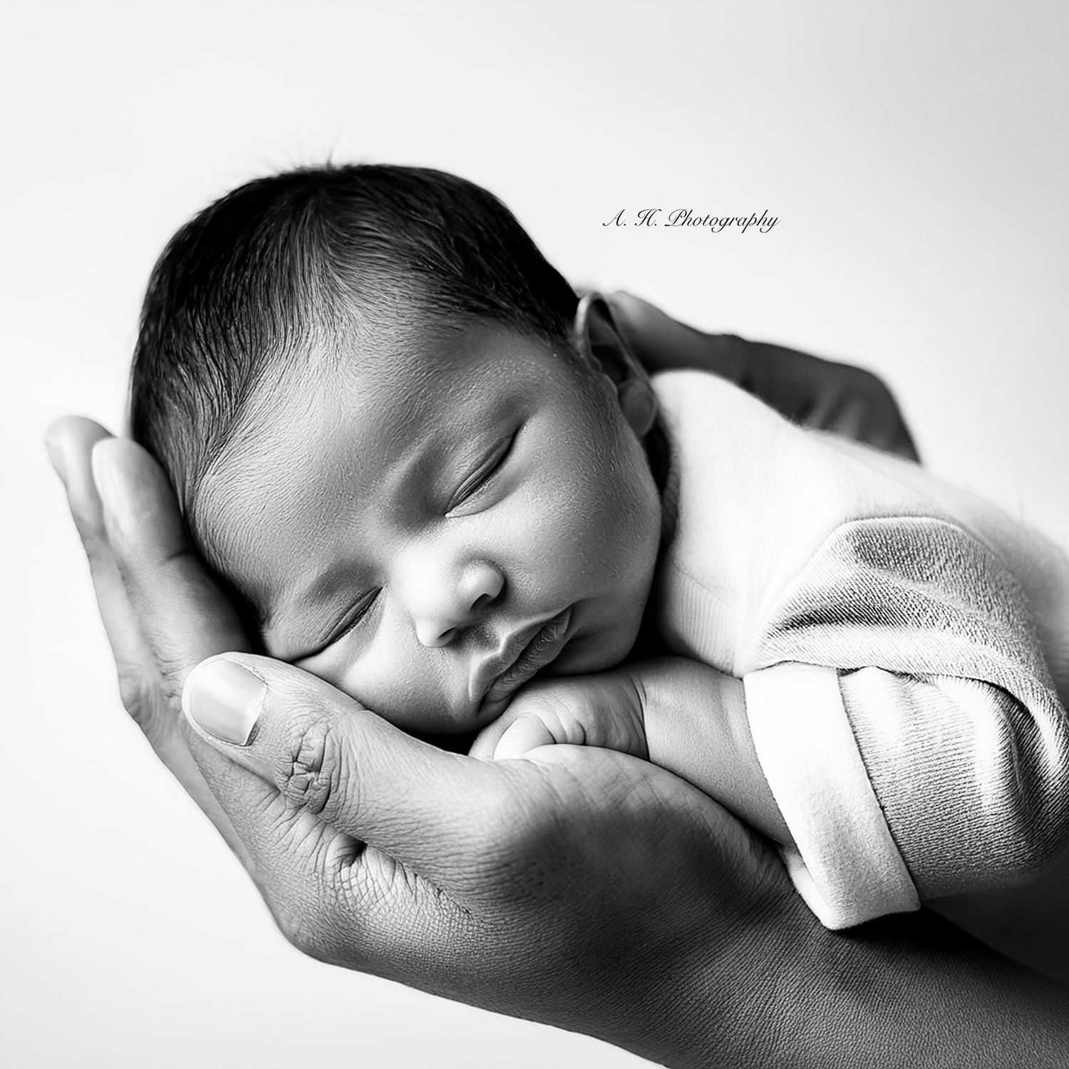Newborn baby in parents hands