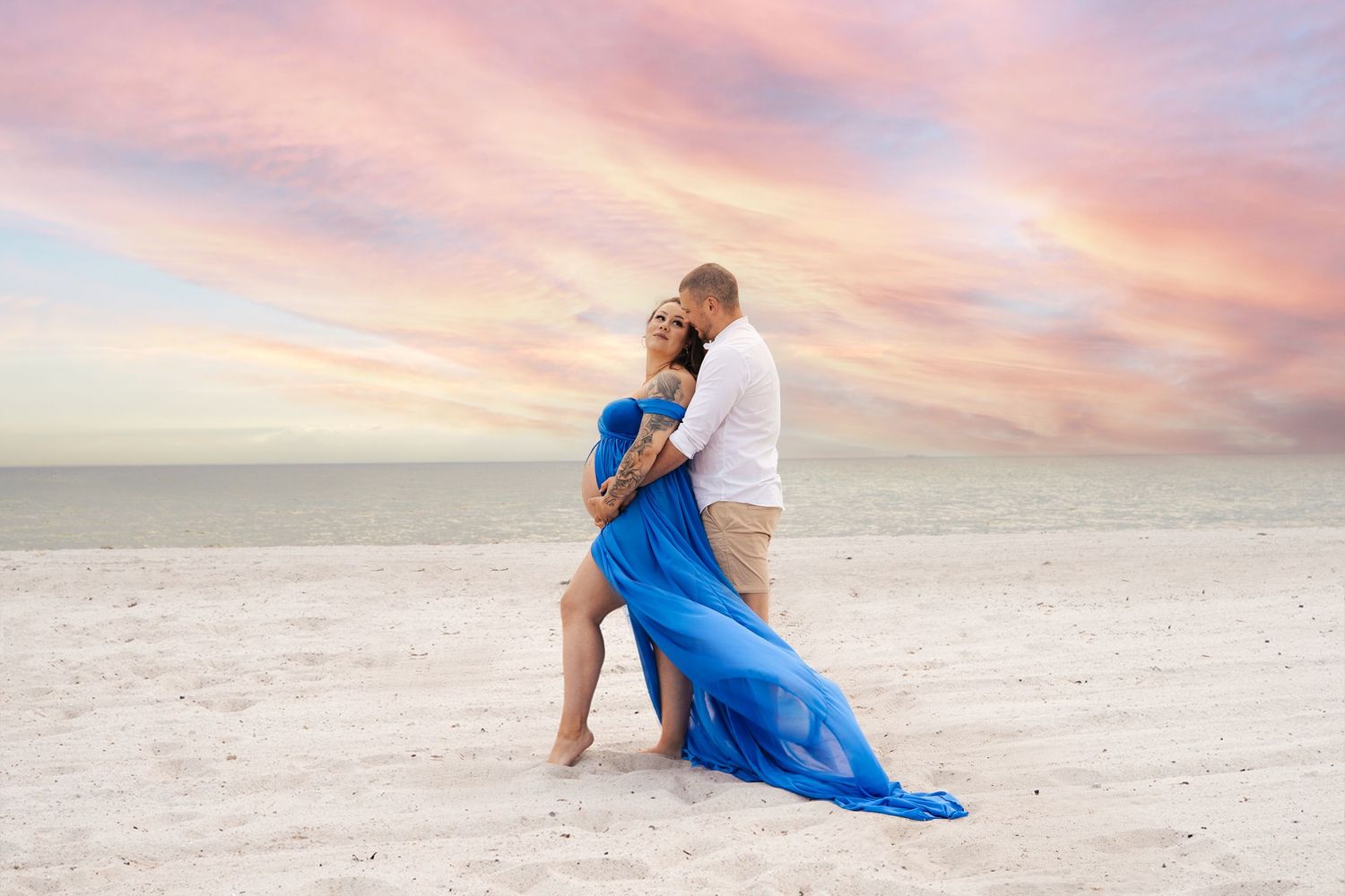 Couple maternity photoshoot on beach