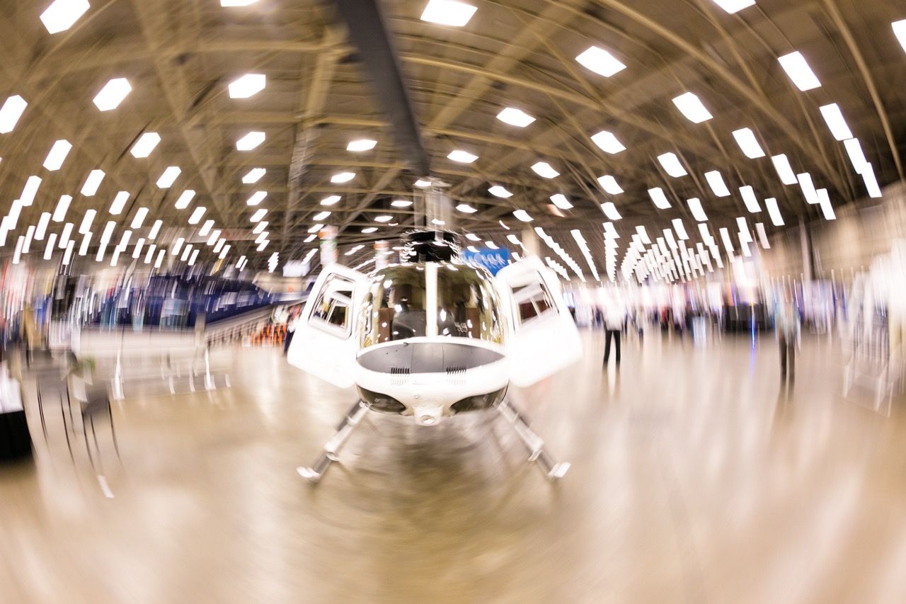 White helicopter on display in the Kay Bailey Hutchison Convention Center, Dallas, TX captured with a fisheye lens & dragging the shutter