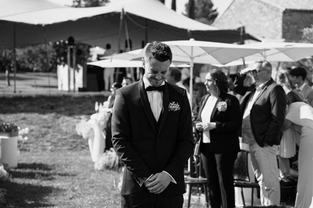 A collection of black and white wedding photographs showing couples and guests at an outdoor ceremony.