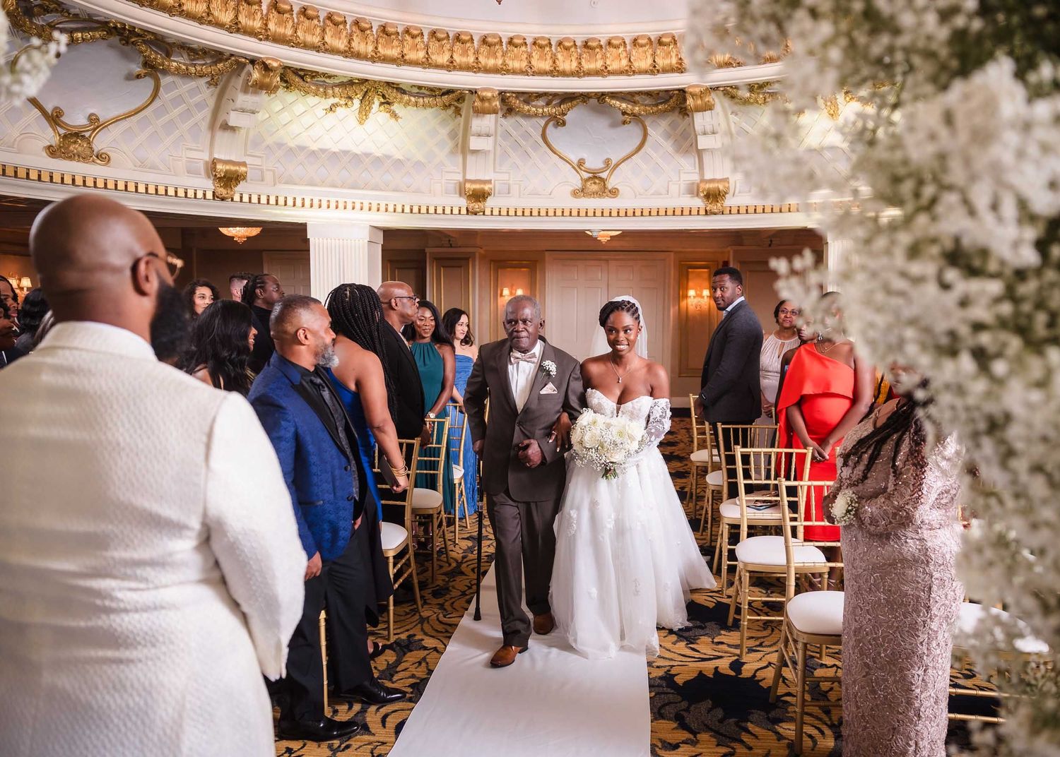 Bride escorted down the aisle by her father during ceremony in the Dome Room at Lenox Hotel Boston