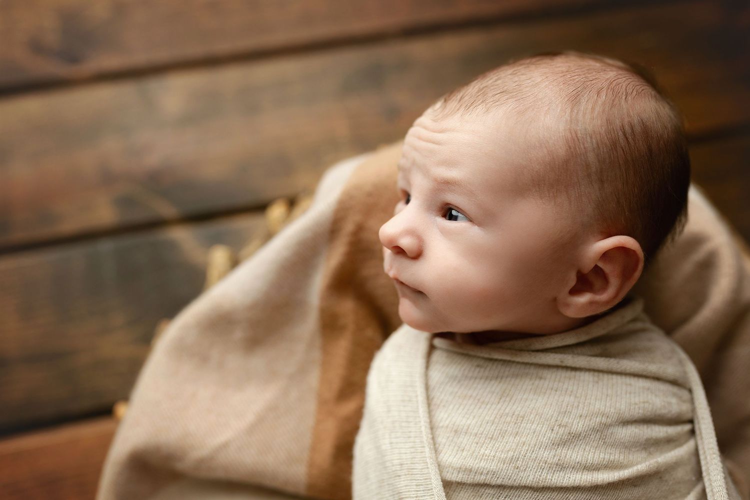 A side profile of a newborn boy wide awake. Greenville, SC newborn photographer, Easley SC newborn photographer, Upstate SC newborn photo