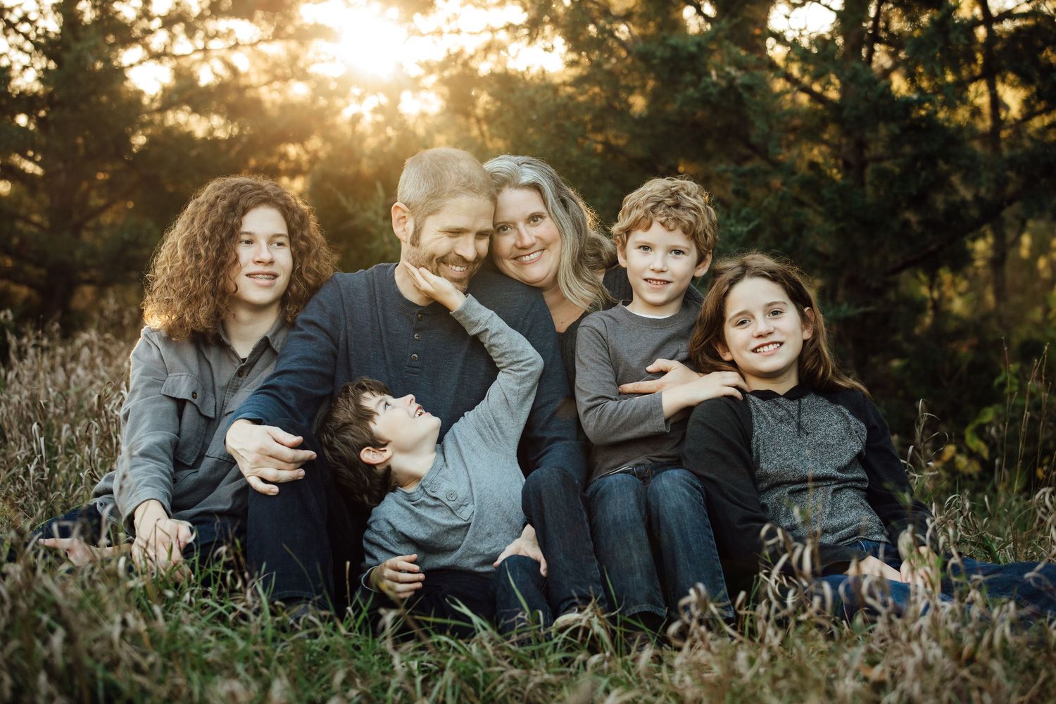 Stunning golden hour lighting for this family portrait session with Rowan Tree Photography of Sioux Falls, memorable family moments.