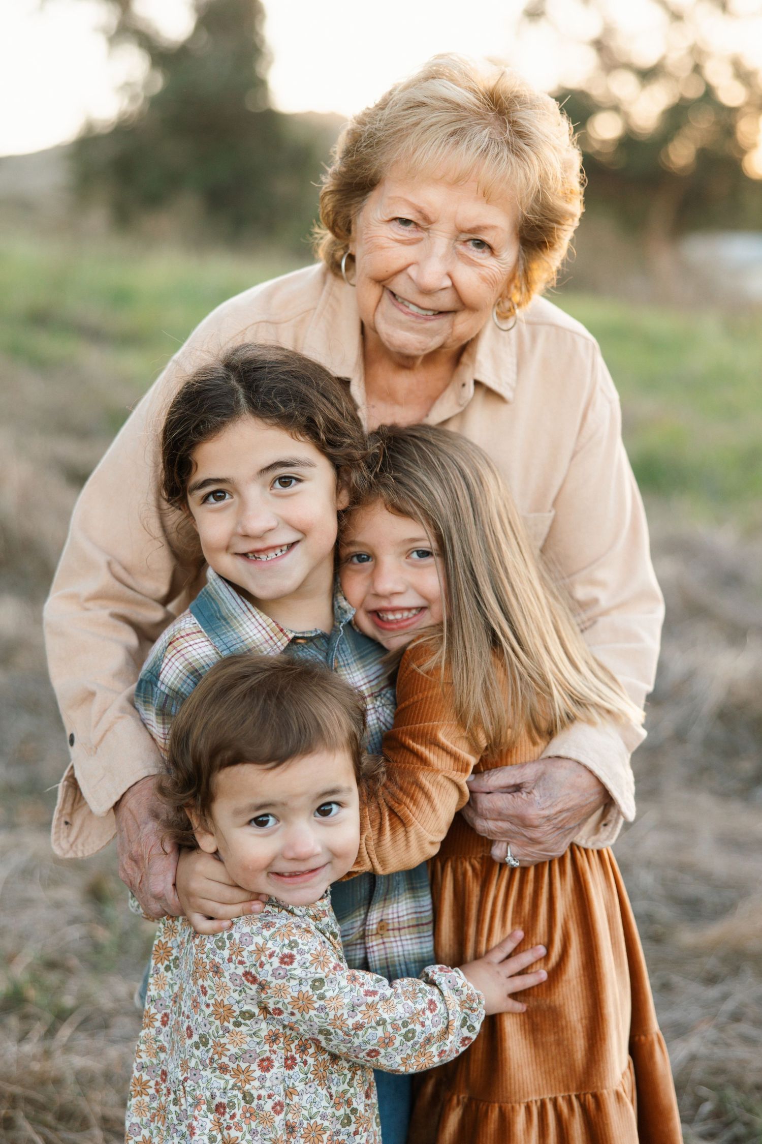 Extended family session in Newbury Park with a grandmother holding her great-grandchildren, capturing a legacy moment