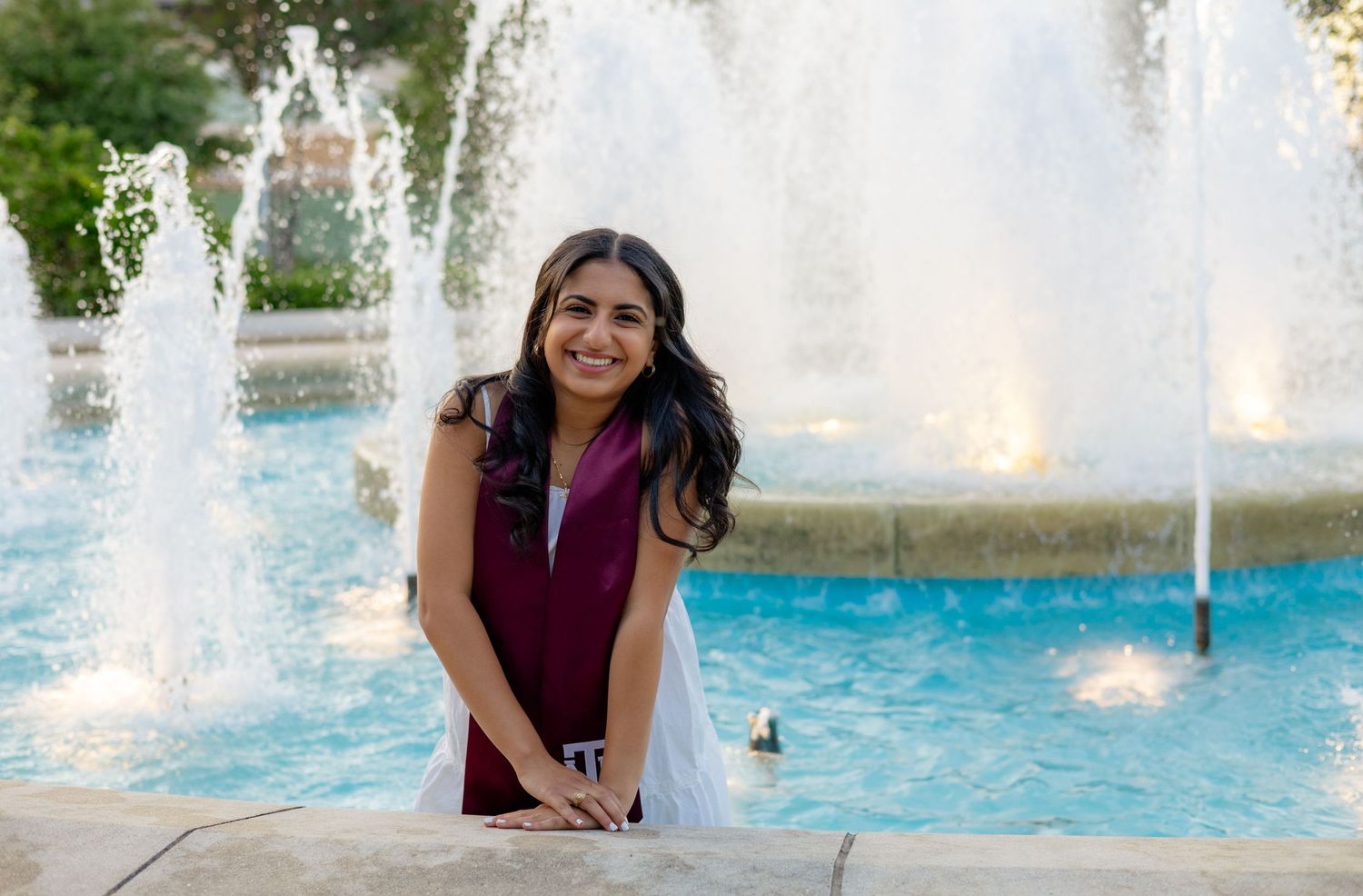 TAMU grad senior photos at Mission Espada standing in white dress