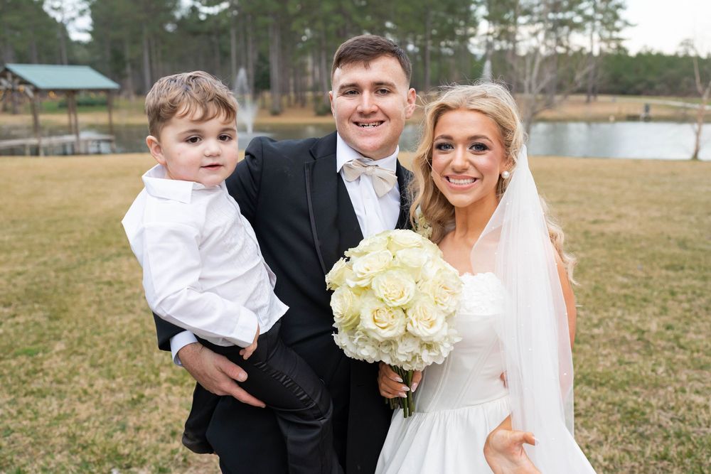 bride and groom with baby boy