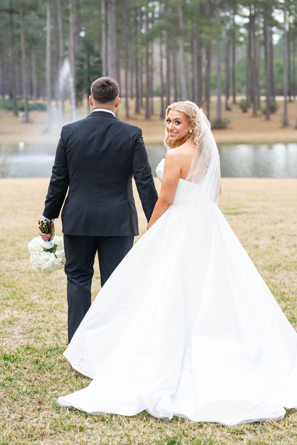 bride looking back with groom