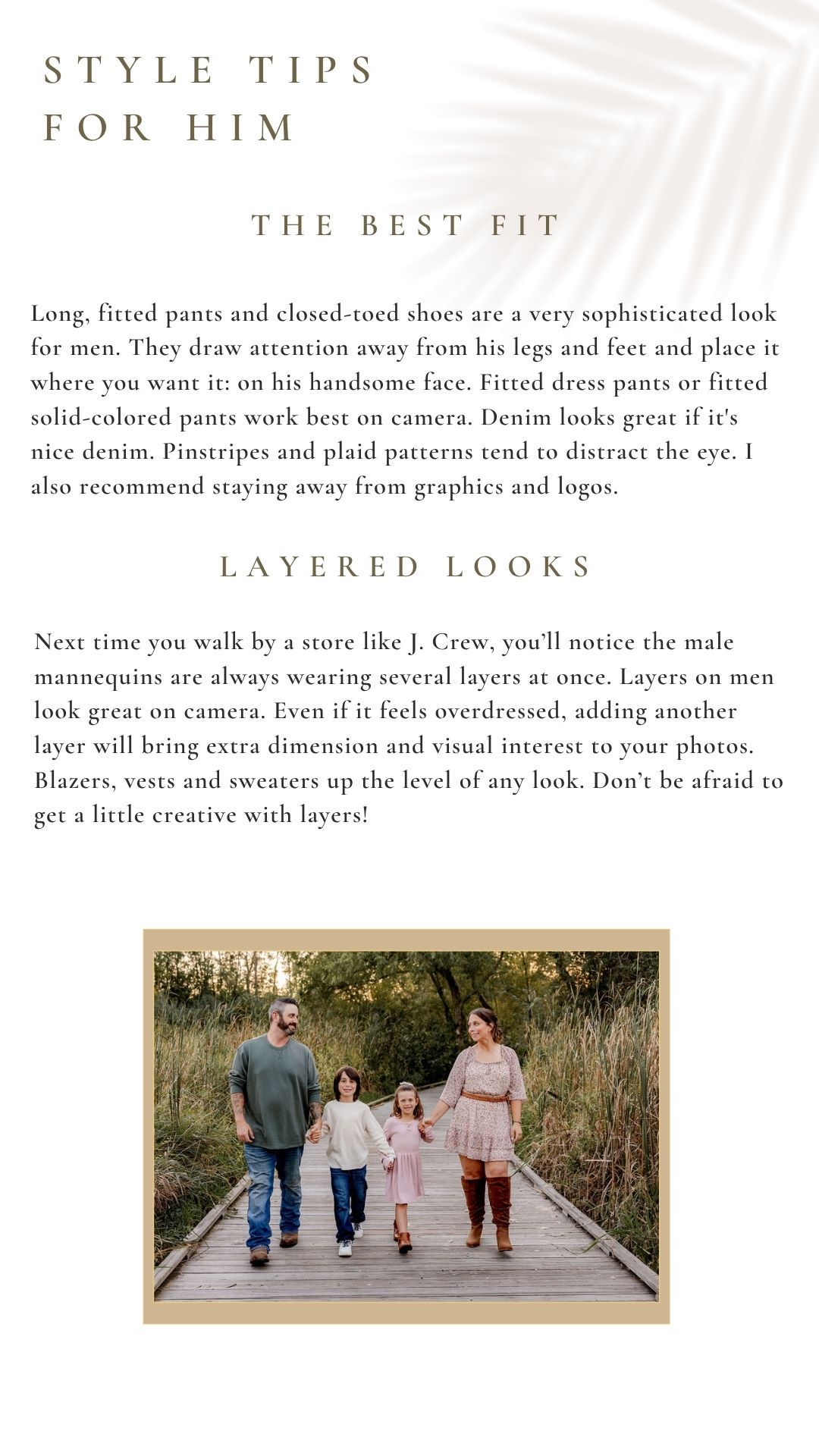 A family of four walks on a wooden boardwalk path surrounded by tall grass, dressed in stylish layered outfits.