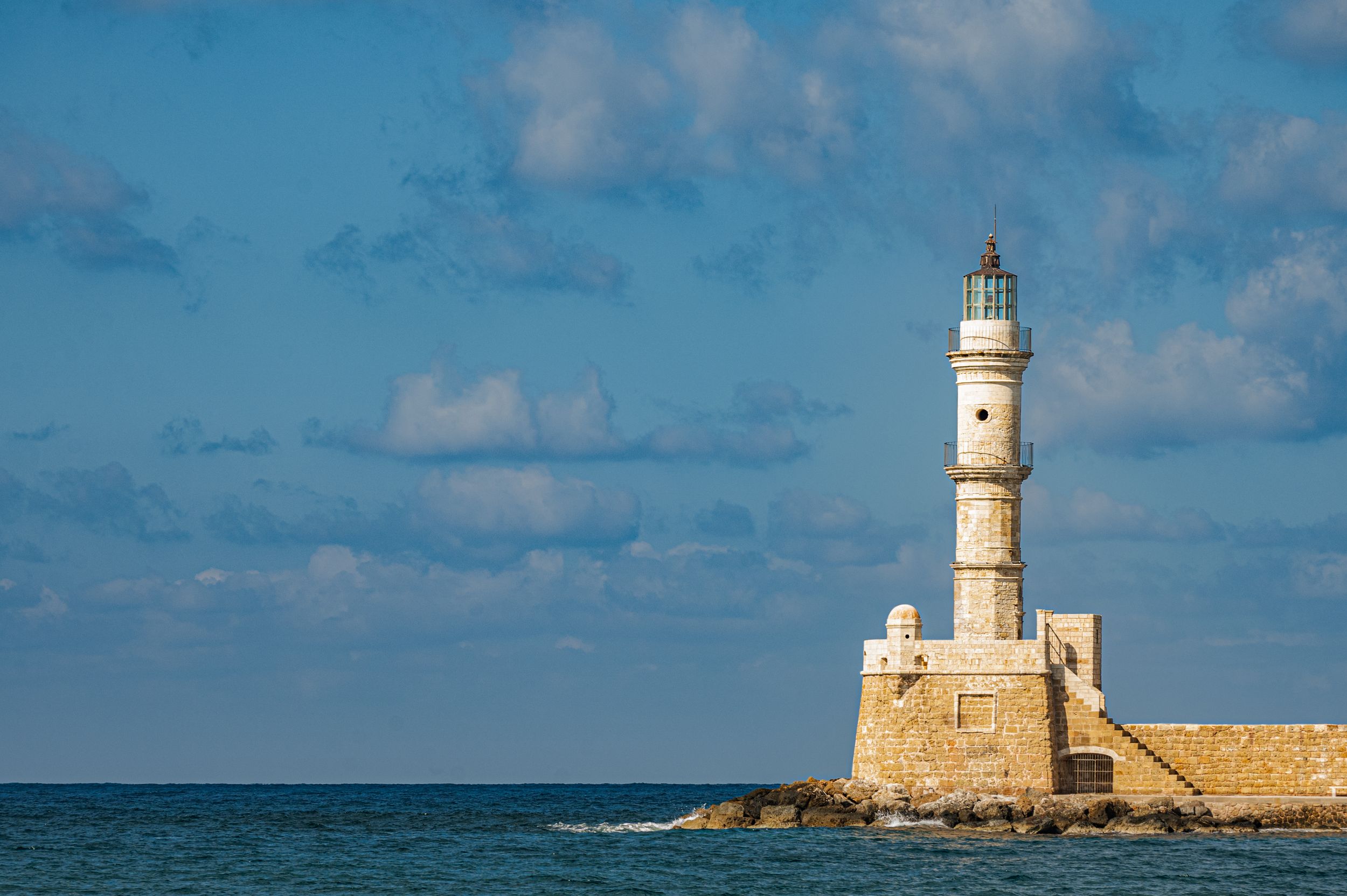 A panoramic collage of lighthouse scenes showing various coastal views and lighthouse structures against blue skies.