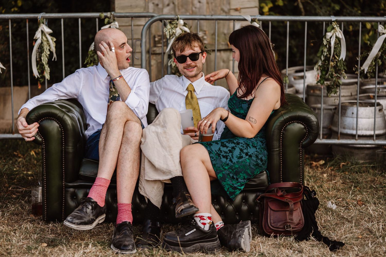 Guests enjoy the wedding at Cerne Abbas Brewery Dorset. Candid wedding photographer based in Weymouth, Dorset