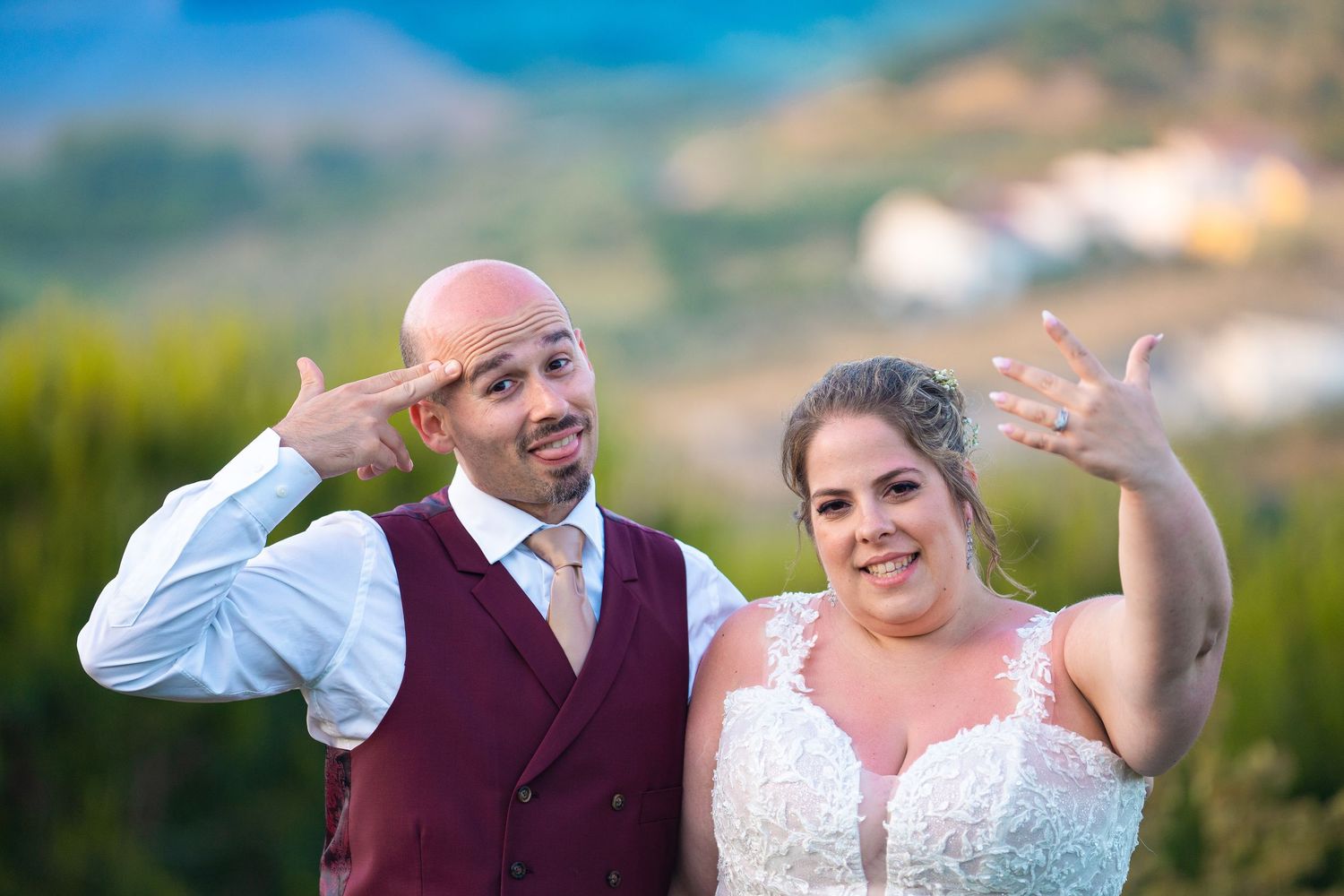 A wedding celebration photoshoot in a scenic outdoor setting with mountain views.