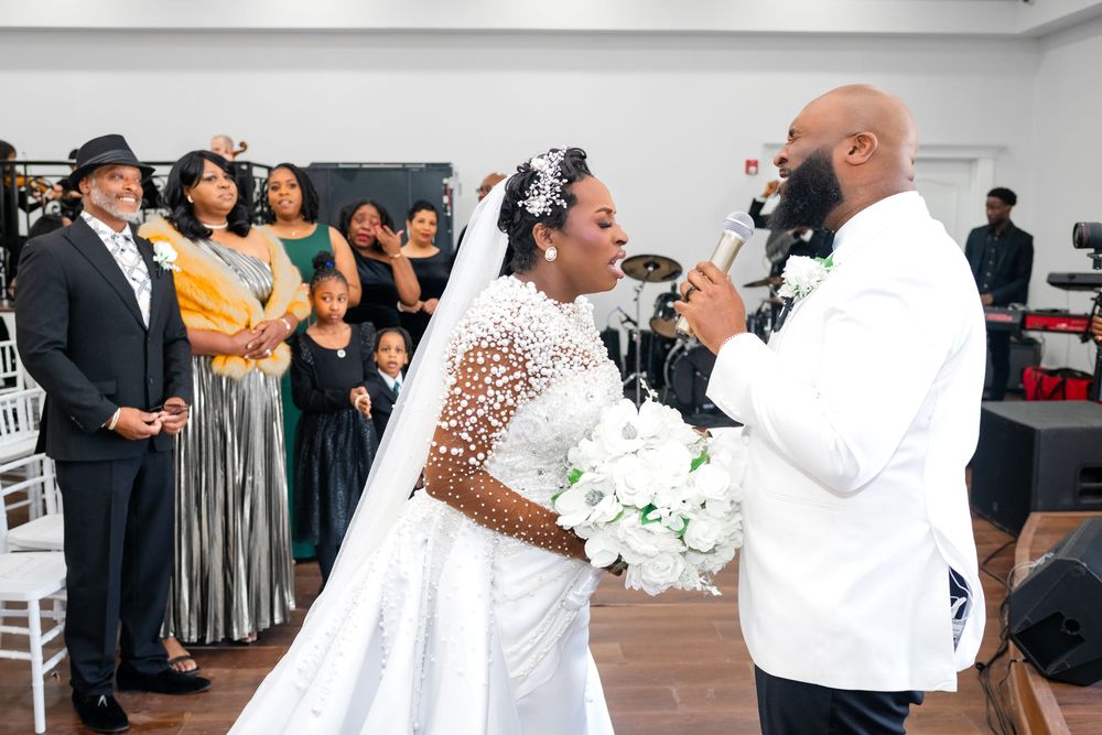 Wedding guests celebrate and dance together during a joyful reception party.
