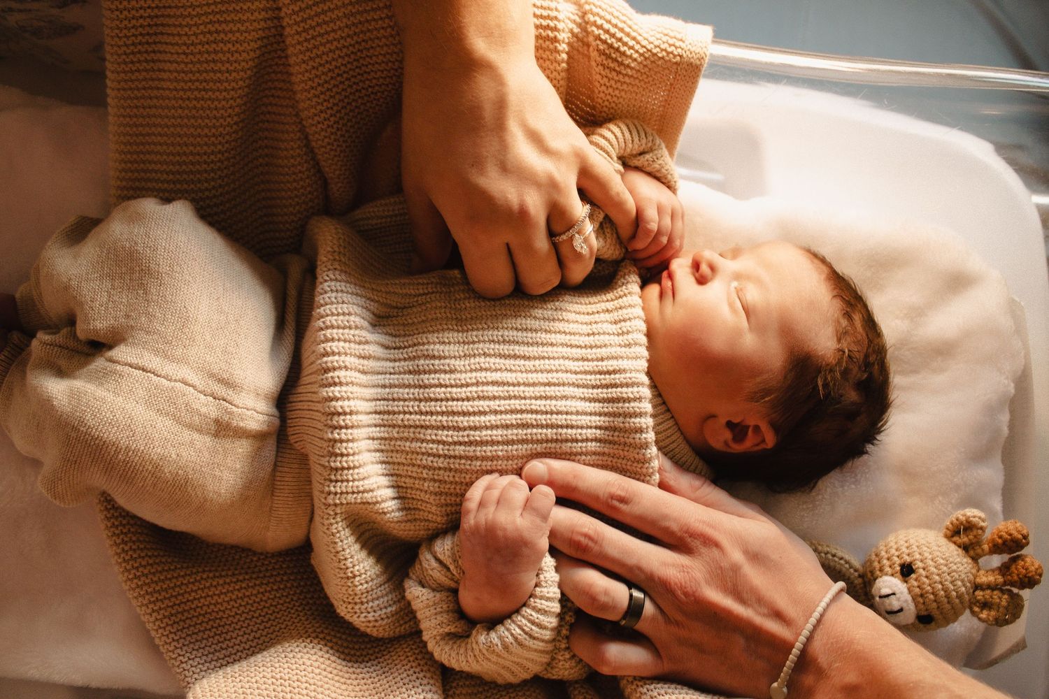 Newborn baby sleeping in hospital bassinet – Northern KY newborn photography