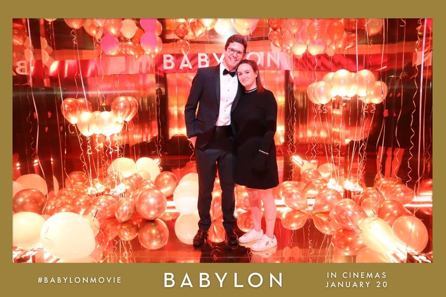 Red and gold movie promotional posters for Babylon displayed in sequence showing dramatic scenes and text.
