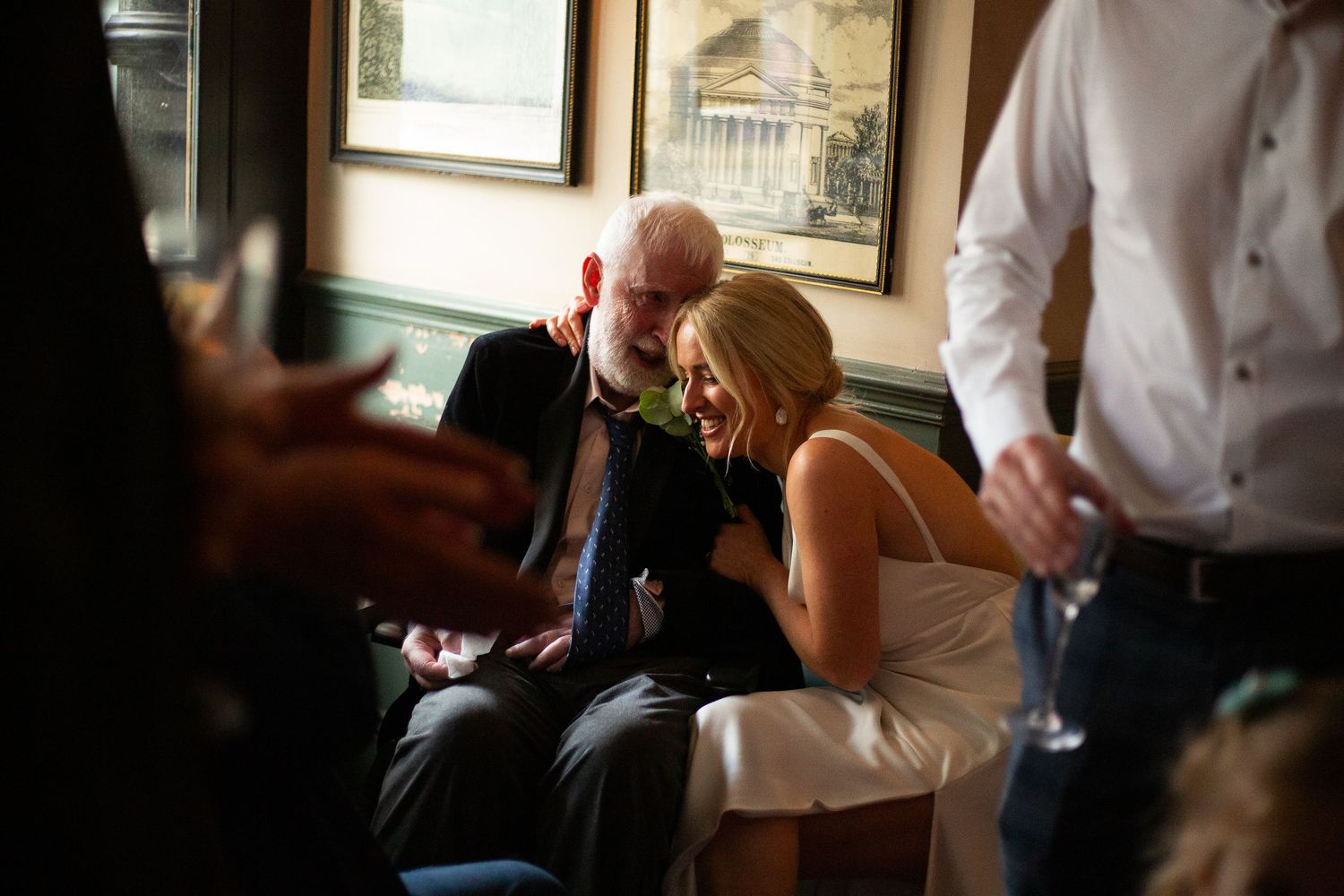 Bride laughing with Father after her ceremony at Old Marylebone Town Hall, at the Pub reception — emotional wedding photography