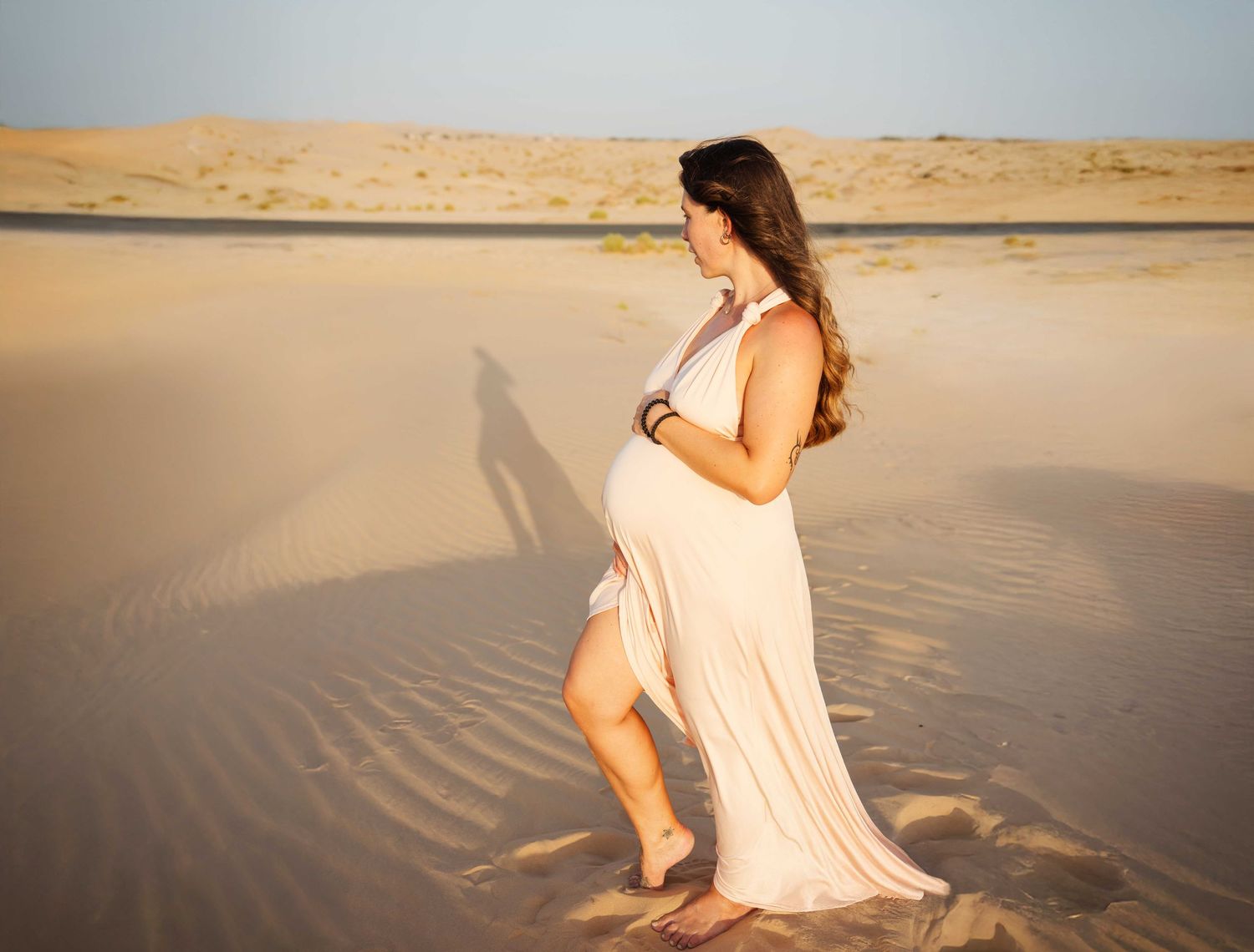 Champaign colored wrap infinity dress photoshoot abu dhabi desert maternity