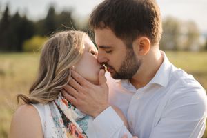 A series of romantic outdoor photos showing tender moments between a couple in warm sunlight.