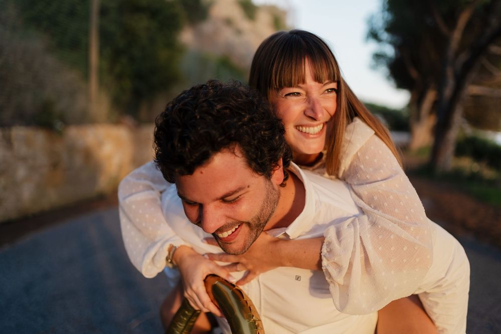 Romantic couple sharing intimate moments together in a natural outdoor setting.
