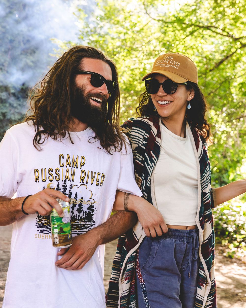 Group enjoying a sunny day outdoors wearing casual t-shirts and sunglasses.