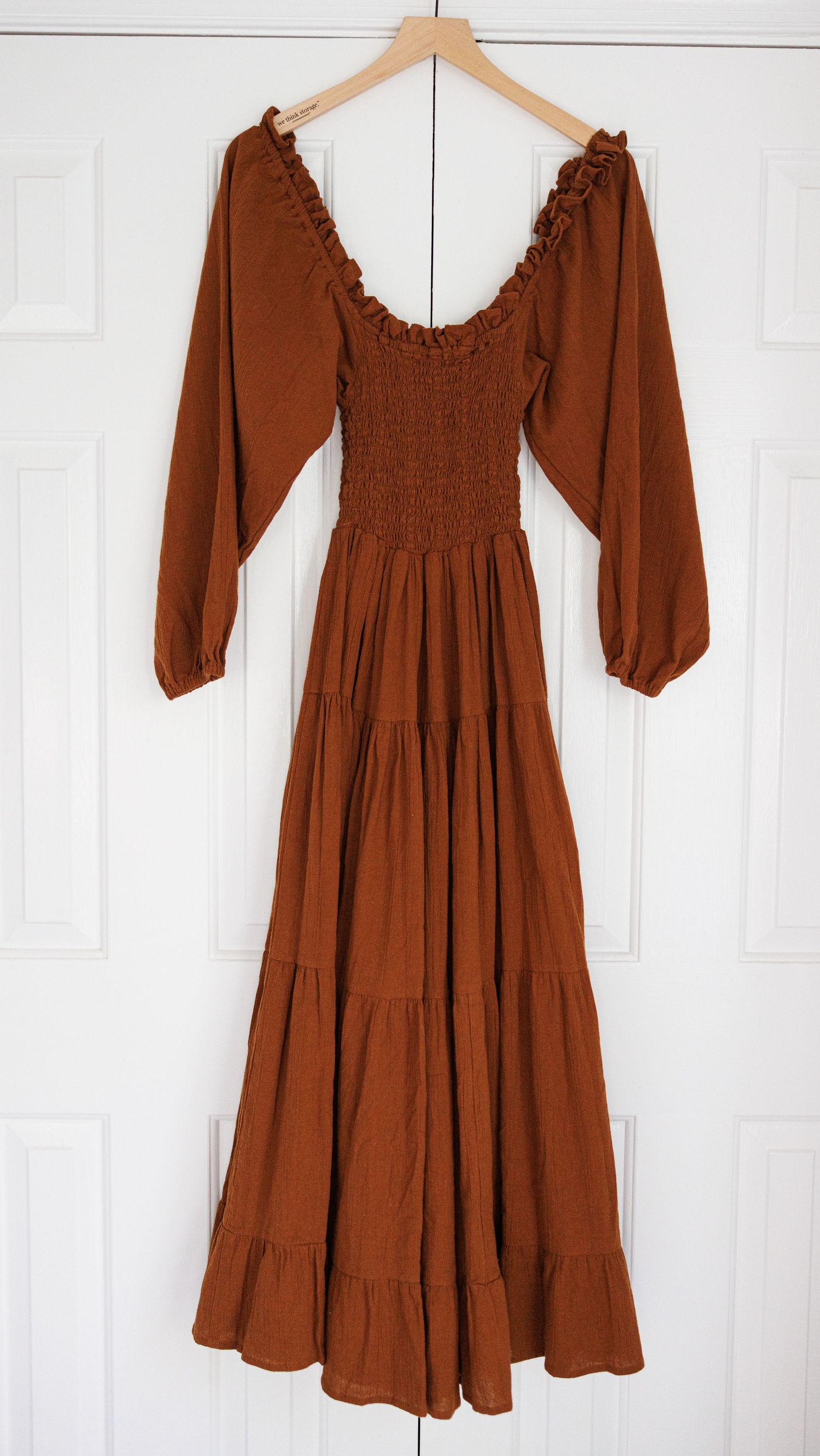 Vintage cream-colored peasant dress with puff sleeves and corset back lacing displayed on mannequin from multiple angles.