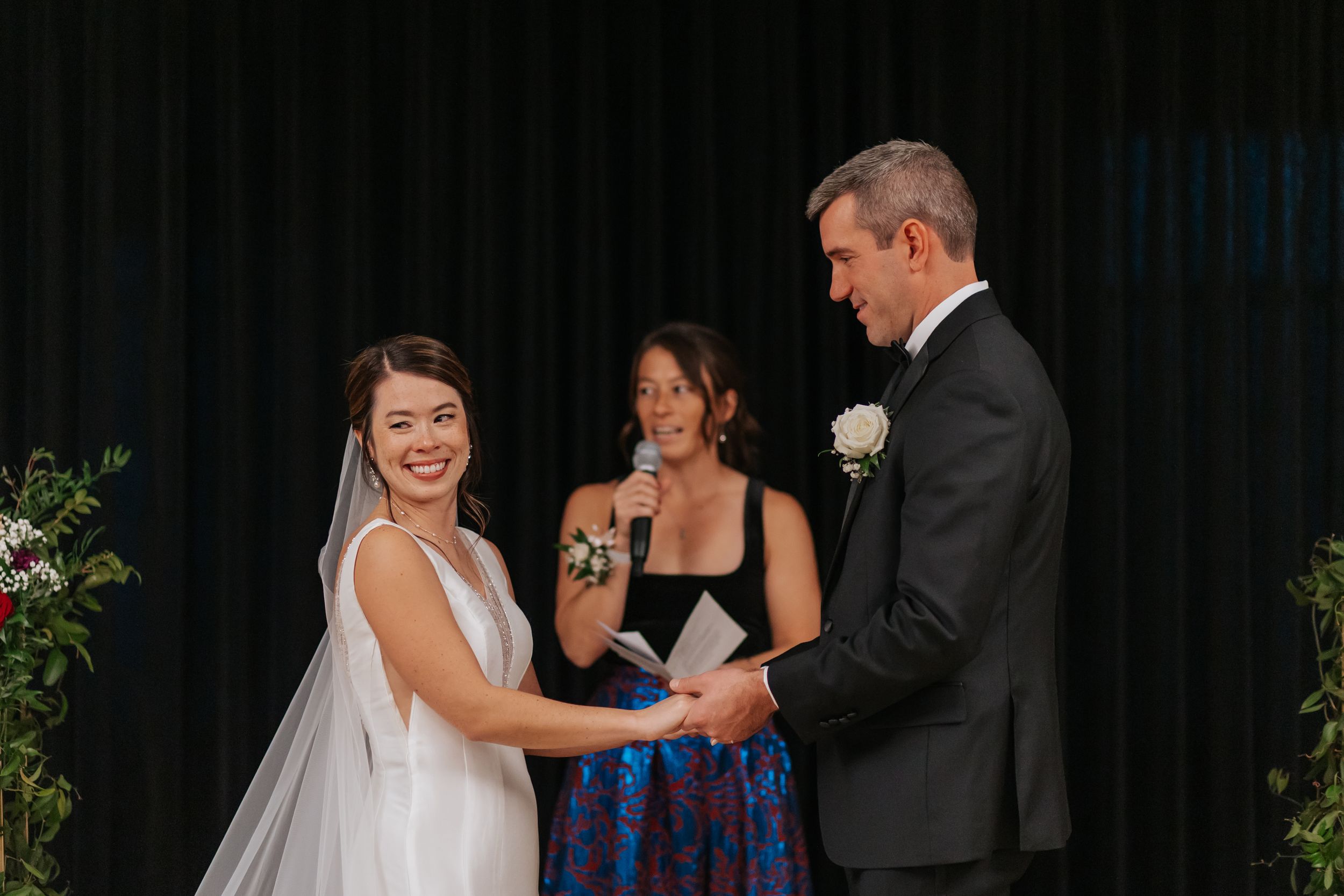 Wedding party celebrates with champagne toasts during an elegant evening reception.