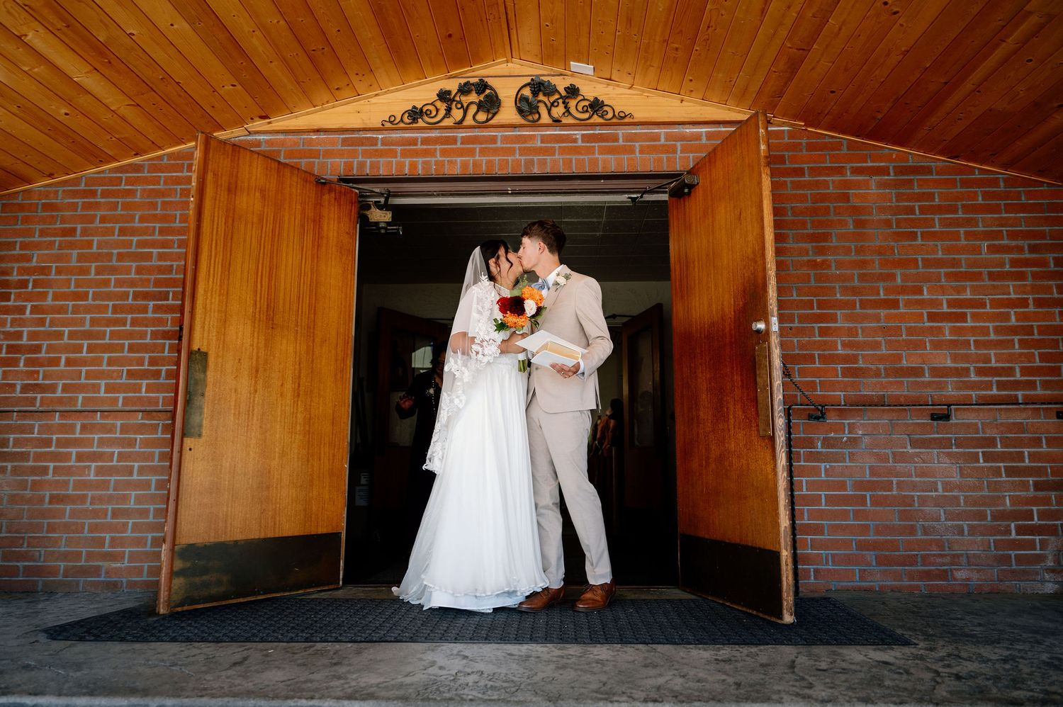 Bride and groom exit their Catholic Church wedding ceremony in Oregon