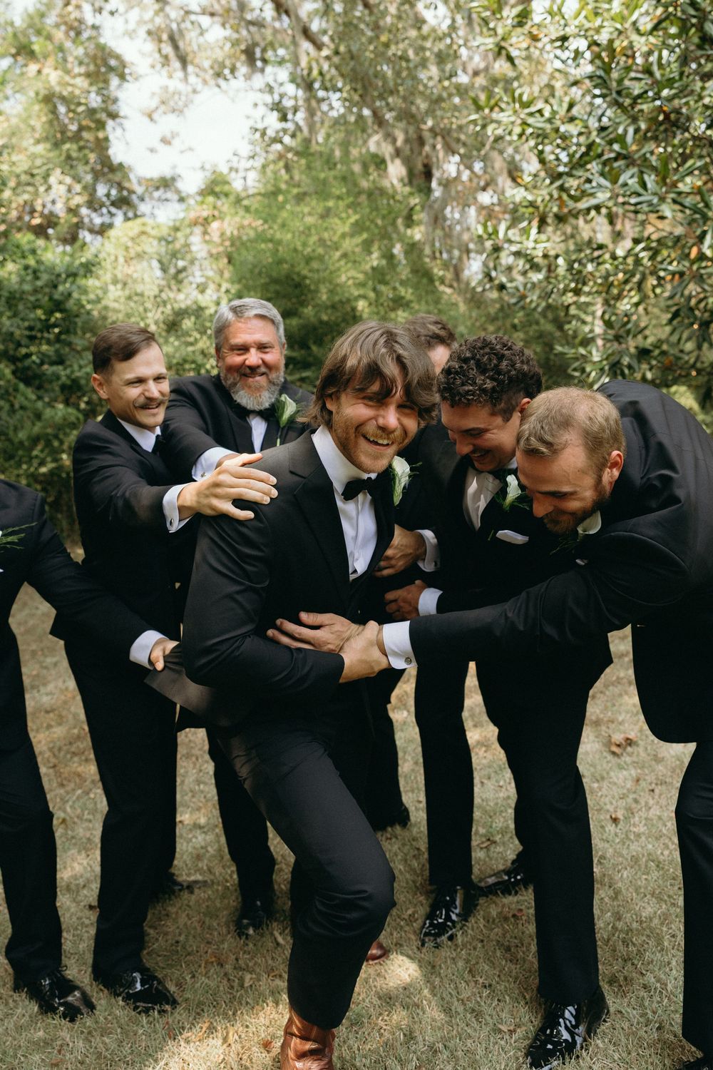 Groomsmen celebrating the wedding day at The Elms of Coosada in Coosada, Alabama