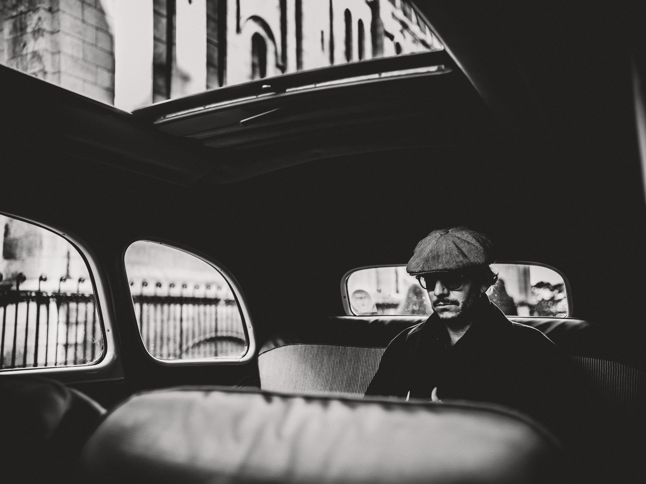Taxi driver waiting for his client, Montmartre, Paris, France. 2023