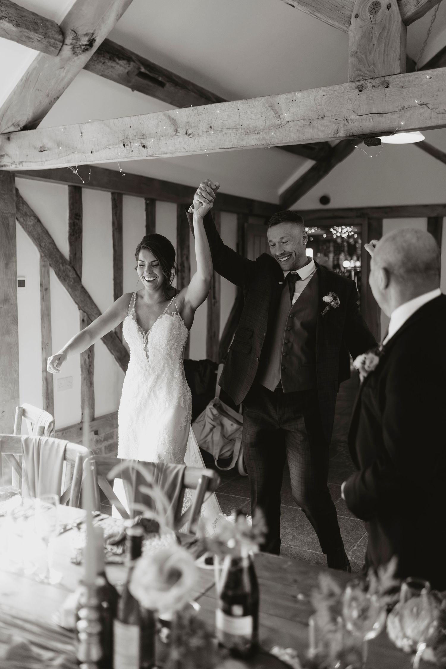 Bride and Groom entering their wedding reception at Camlad Barns.
