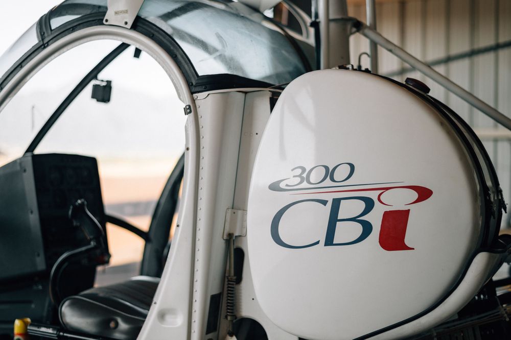 Detail shots of helicopter markings and badges showing CB and 300 branding.