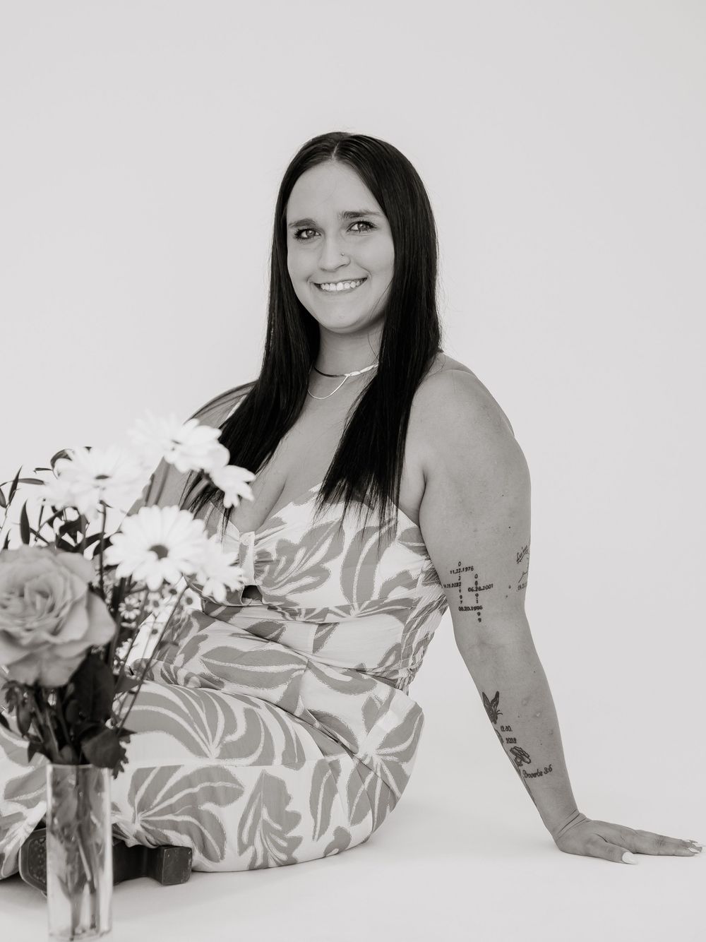 Black and white portraits showing someone posing with flowers and food displays.