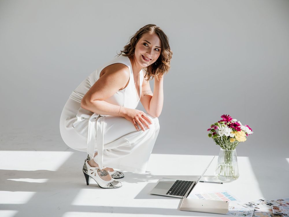 Lifestyle workspace photos with laptop, flowers and vintage decor in bright natural light.