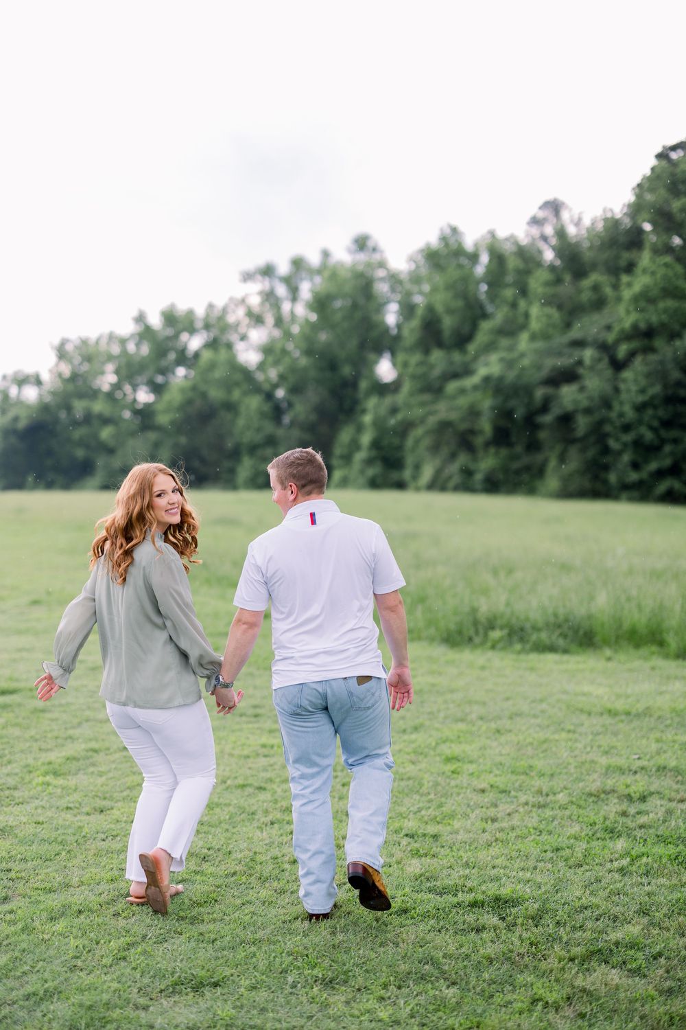 Couple walking hand in hand through a serene green meadow on a sunny day, captured in a sequence of photos.