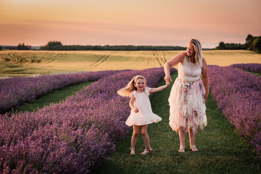 Ontario family photographer capturing a mother and daughter in lavender fields at Grey Silo Farm in Port Perry.