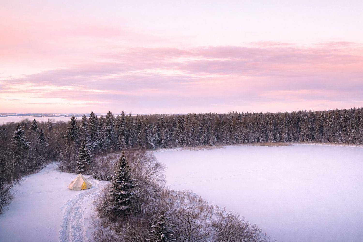 Winter camping scene with a canvas tent, snowshoes, and snowy forest landscape in the background.