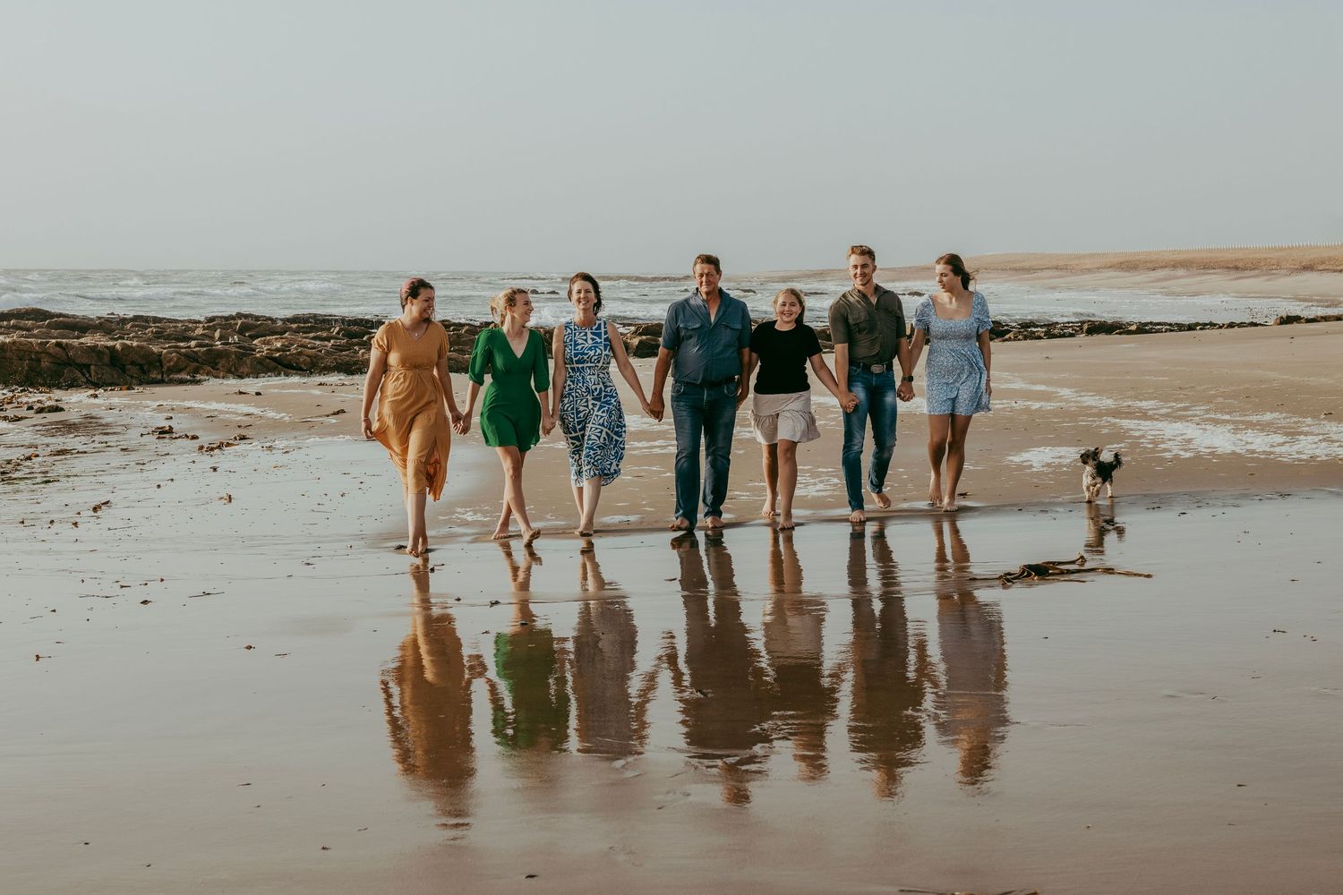 Family during a beach photoshoot in Swakopmund, capturing candid family moments by the ocean.