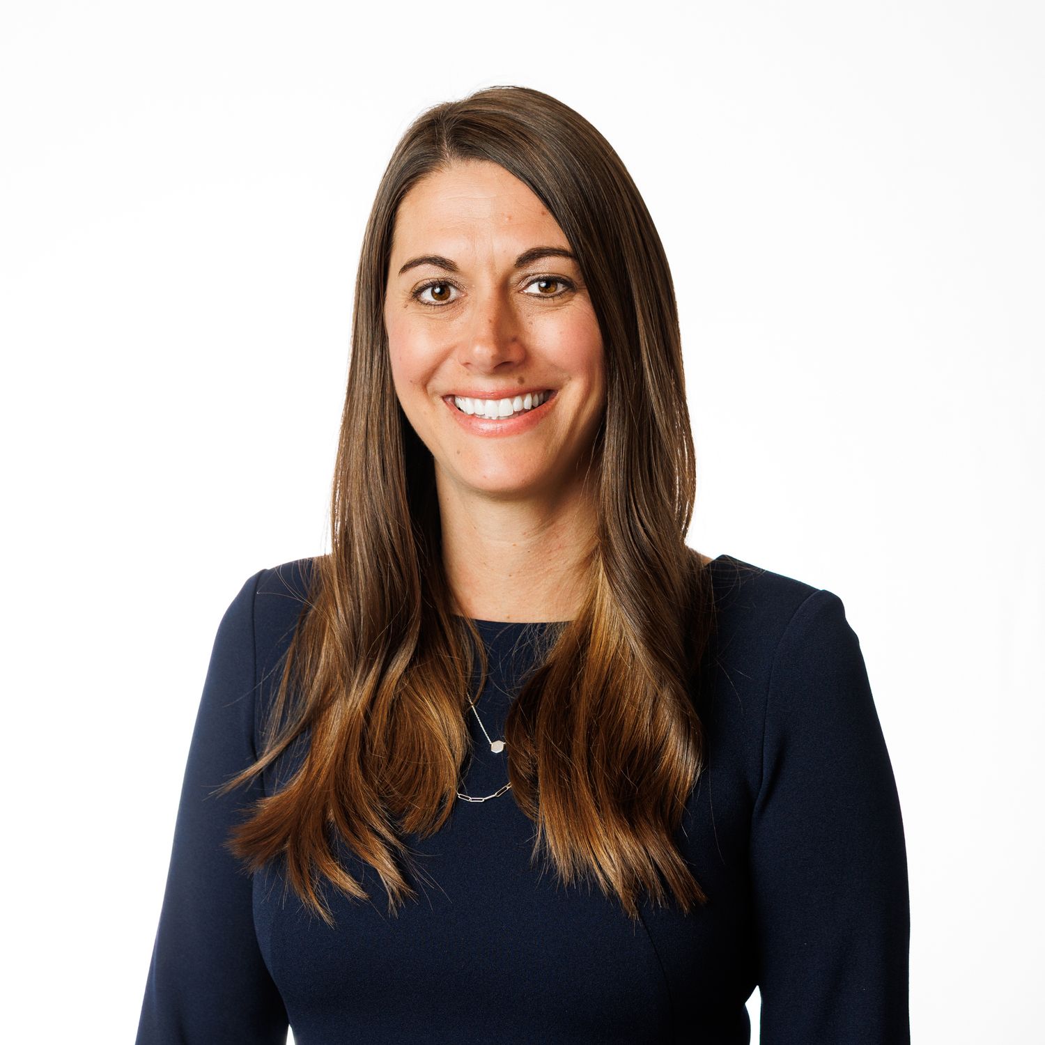 Professional headshots showing the same person in professional attire against a white background.