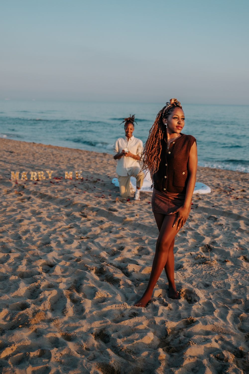 Dawine proposing to Harmonie at sunset