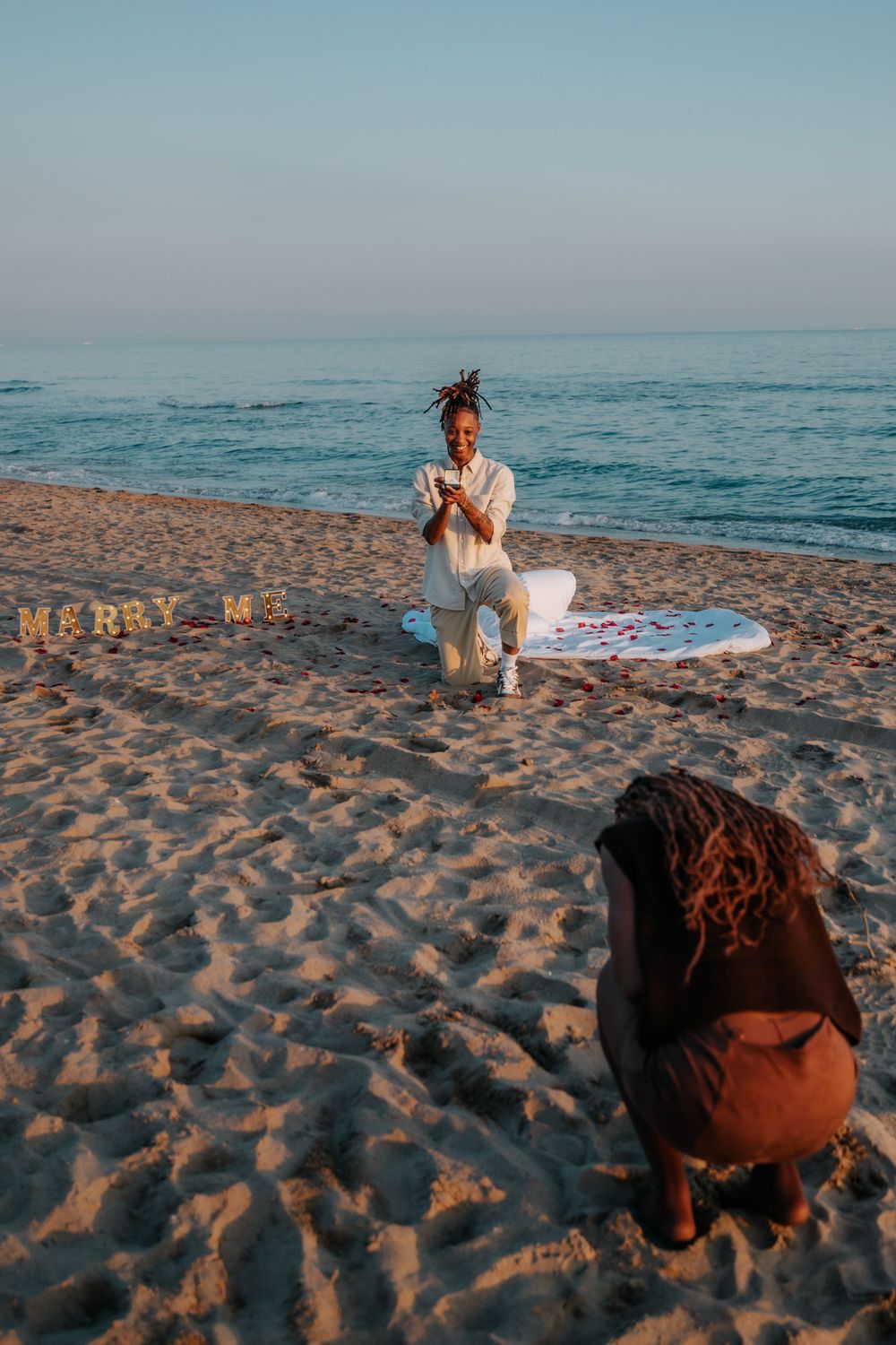 Emotional reaction to romantic beach proposal