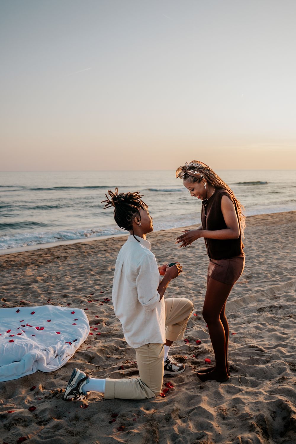 Dawine smiling while on one knee