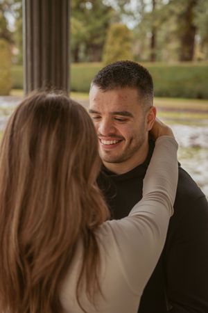 A romantic close-up sequence of a couple sharing tender moments together outdoors.
