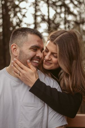 Couple sharing playful intimate moments in a series of close-up portrait shots outdoors.
