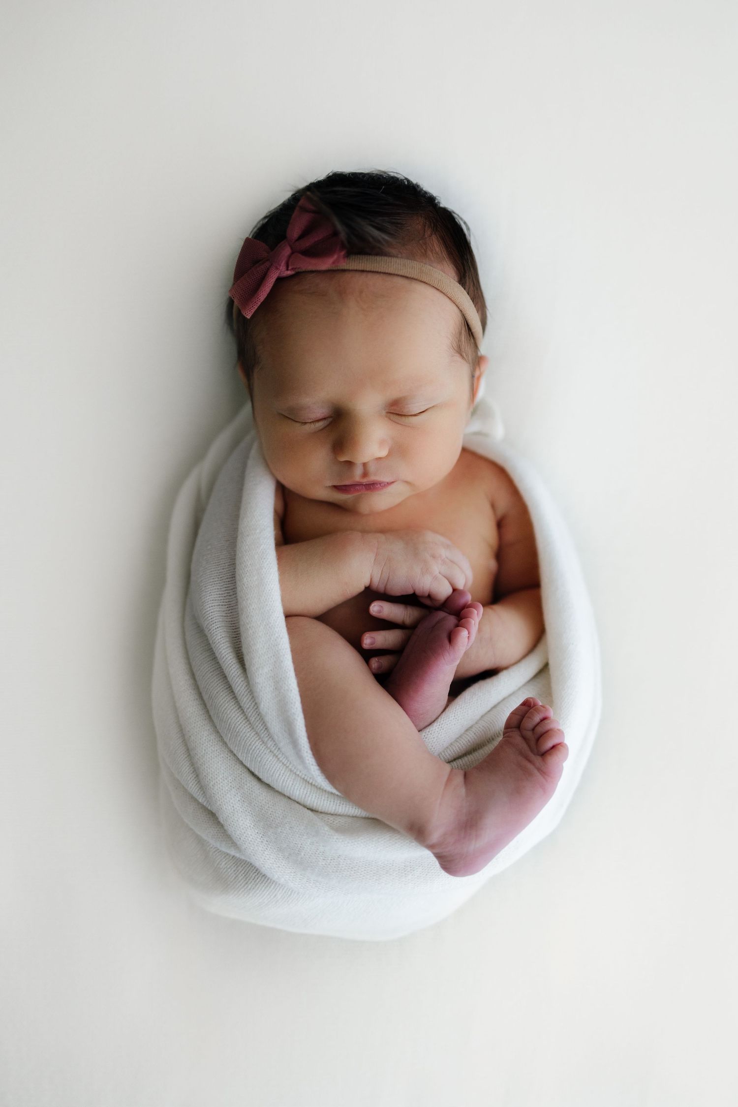posed wrapped newborn photoshoot