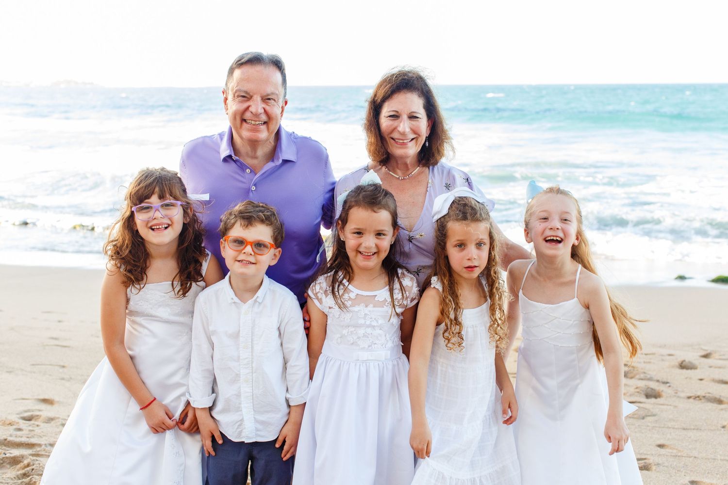 Family portrait on the beach. Grandparents and grandchildren. San Juan, Puerto Rico.