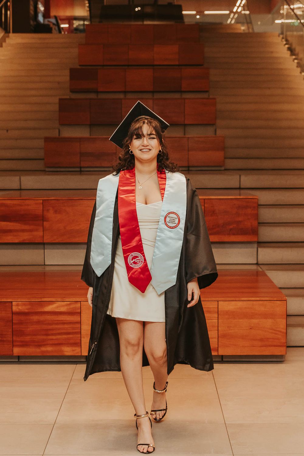 Graduation photos on EWU campus in Cheney, WA with emotional storytelling elements inside of Eastern Washington University PUB