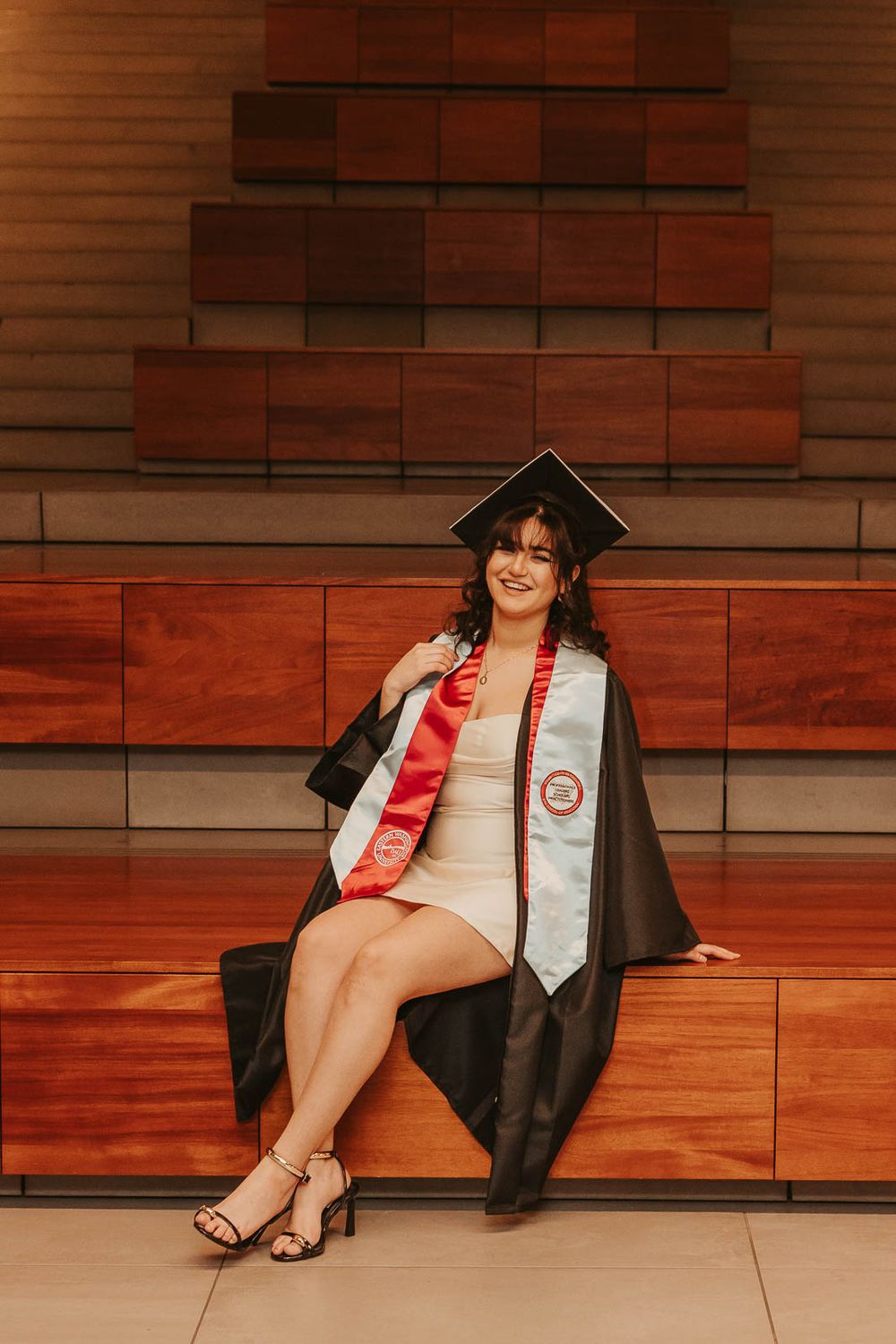 Graduation photos on EWU campus in Cheney, WA with emotional storytelling elements inside of Eastern Washington University PUB