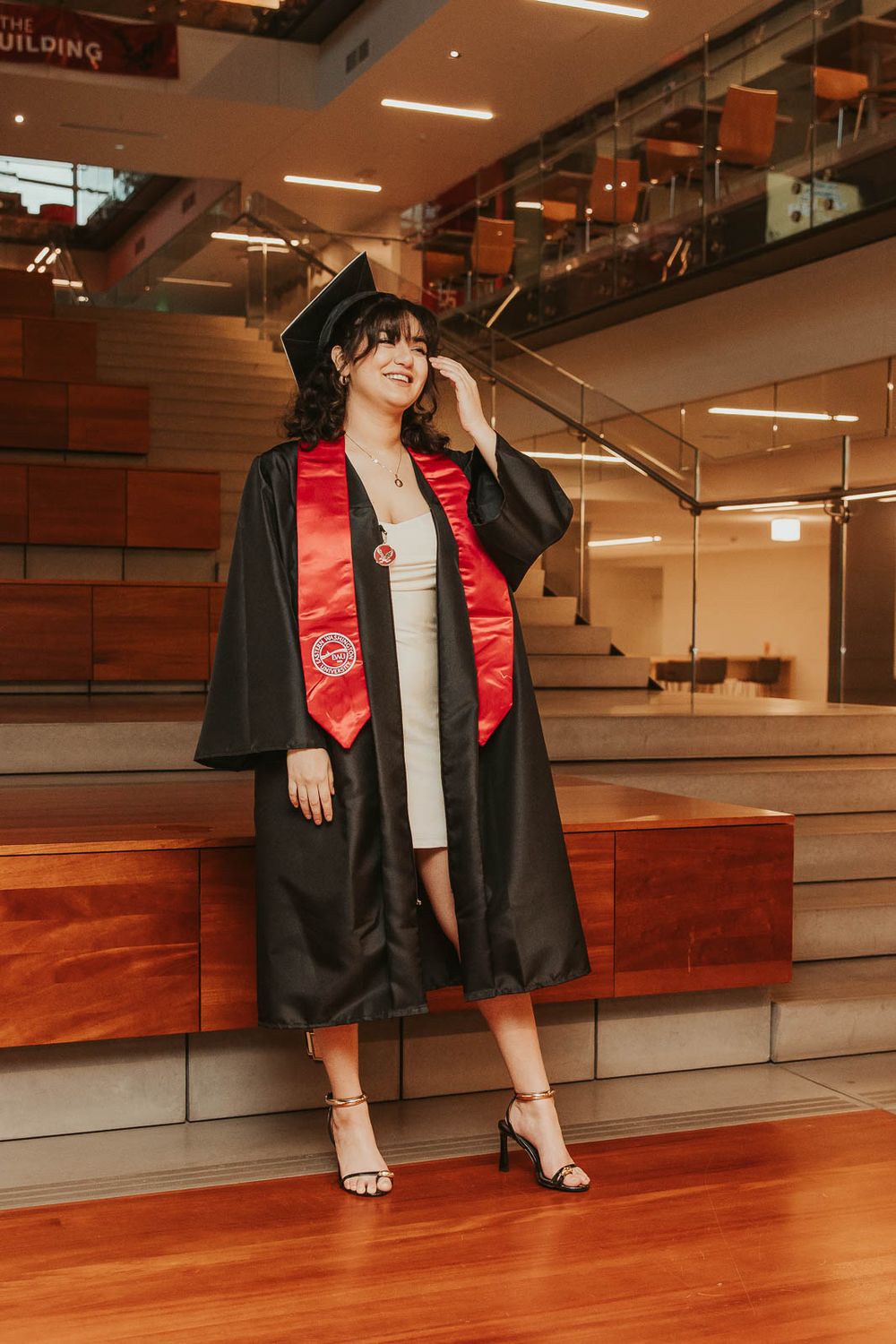 Graduation photos on EWU campus in Cheney, WA with emotional storytelling elements inside of Eastern Washington University PUB