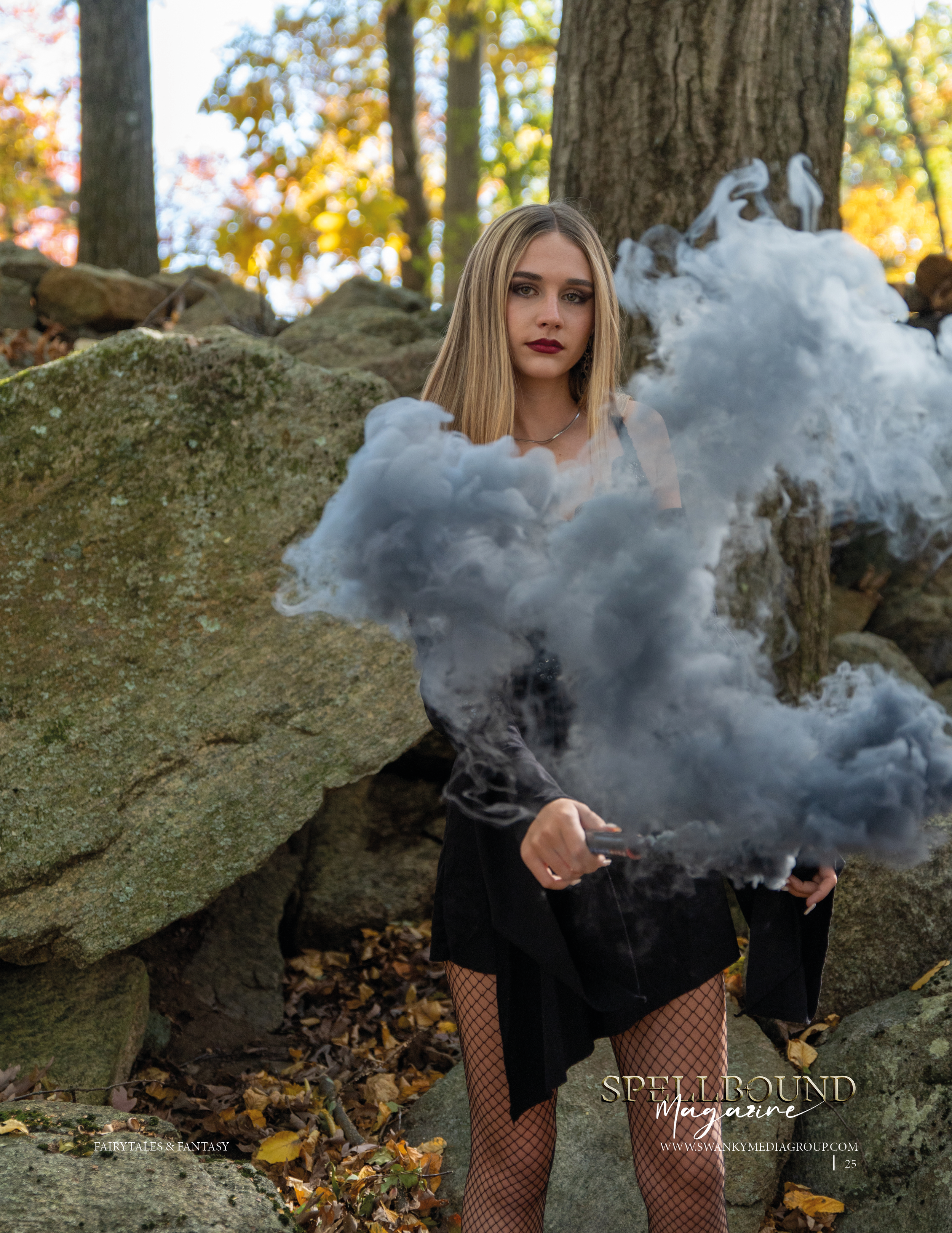Atmospheric autumn portrait with grey smoke effects among rocks and fallen leaves in a forest setting.